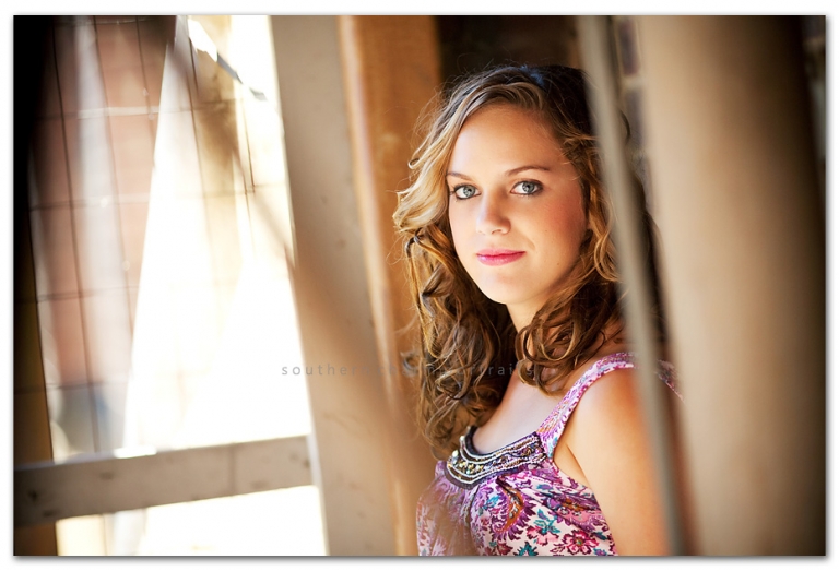 sparkly eyes and curly hair high school senior serious look and expression
