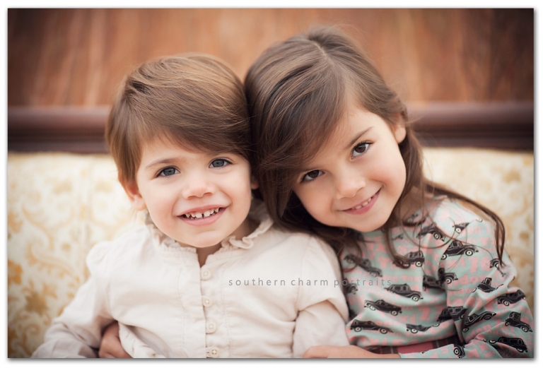young sisters wearing matilda jane on antique couch in field