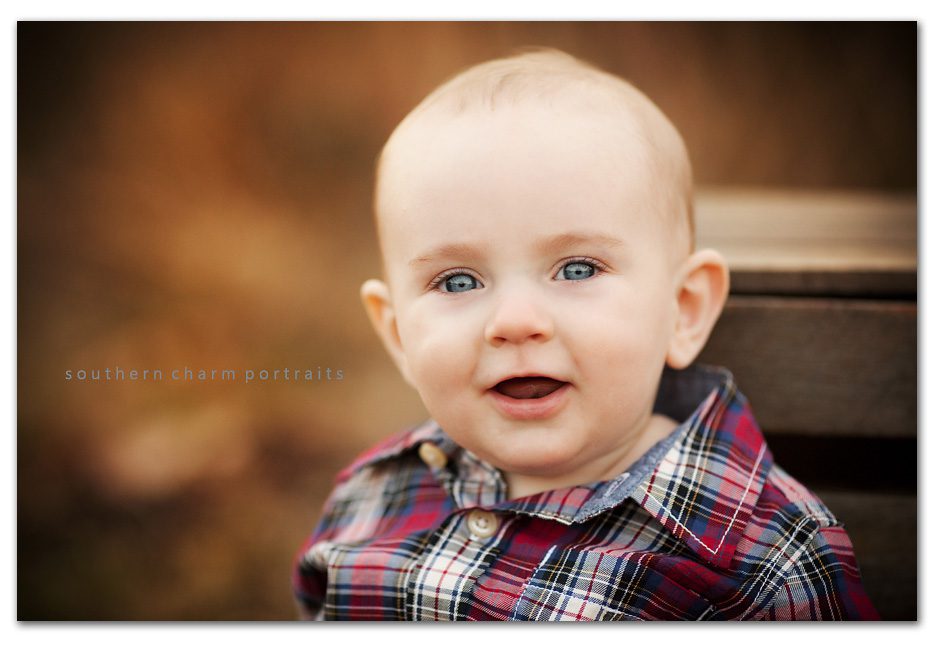 little brother smiling and sitting up all by himself