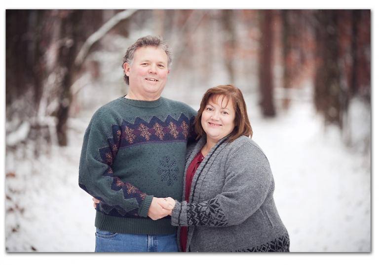 grandma and grandpa in the snow smiling together what a sweet moment