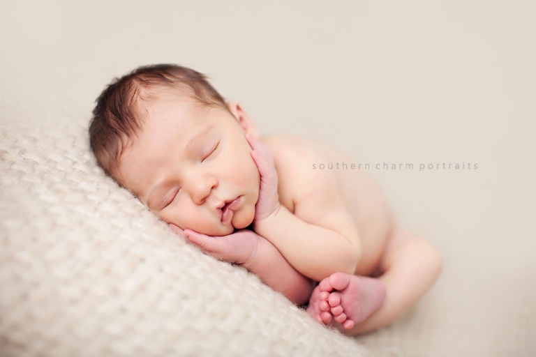 baby sleeping on blanket