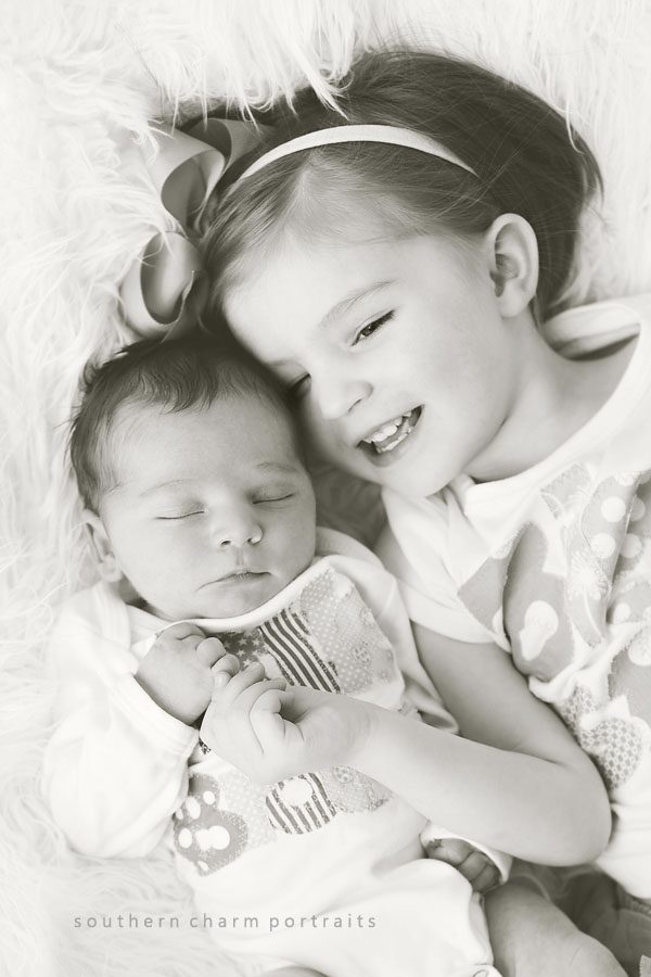 bis sis and little bro snuggling on blanket
