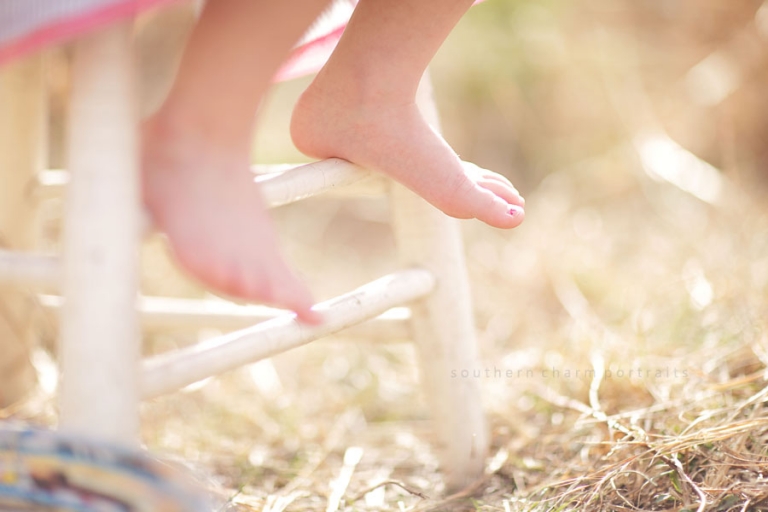 little girls' feet and painted toes