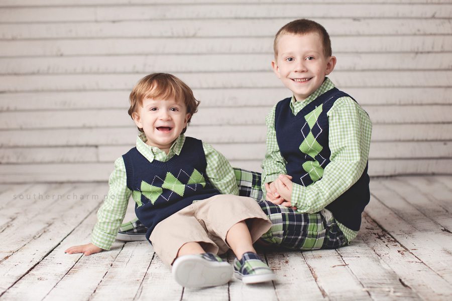 two brothers in studio wearing easter vests