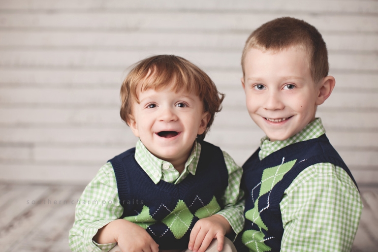 brothers sitting and smiling together