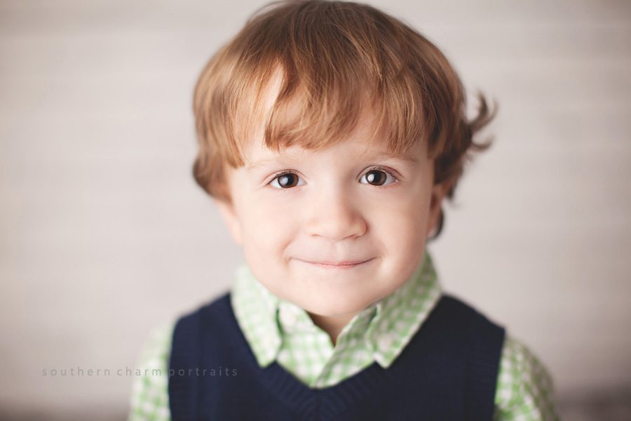 little boy with brown eyes and curls 