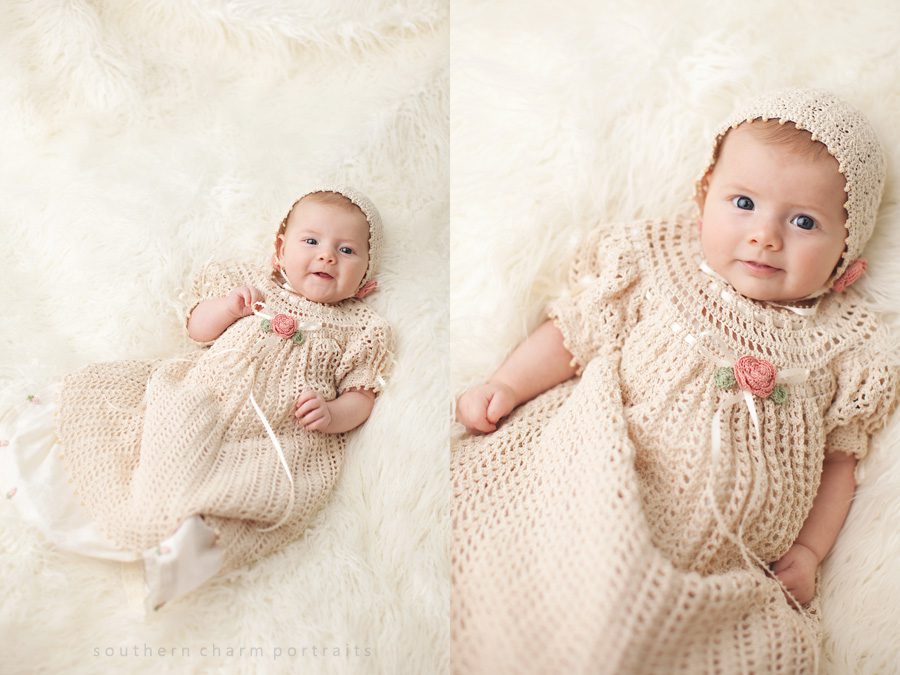 little baby girl in hand made christening gown with matching bonnet