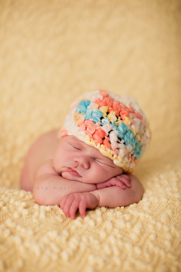 newborn sleeping with knitted hat