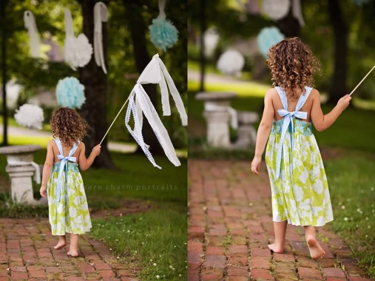 little girl modeling halter dress, back view