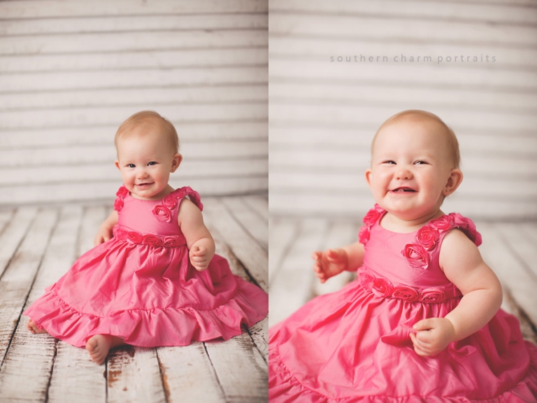 baby in local portrait studio with beautiful pink dress